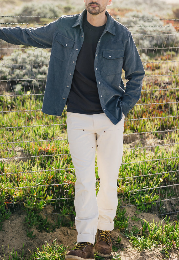 Men's Draftsman Pant in soft washed cream featuring double-front panels and copper rivets, styled with the Western Cord Shirt in Aegean Blue by Ventana Supply Co.