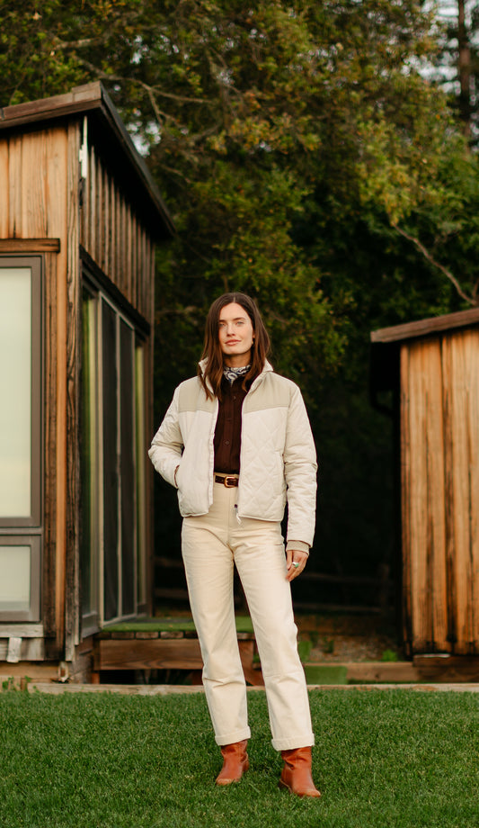 Women's quilted Cruiser Jacket in cream styled with the Cove Shirt in Mocha and 100% cotton Lily Pants in softwash cream for a monochromatic outdoor look.