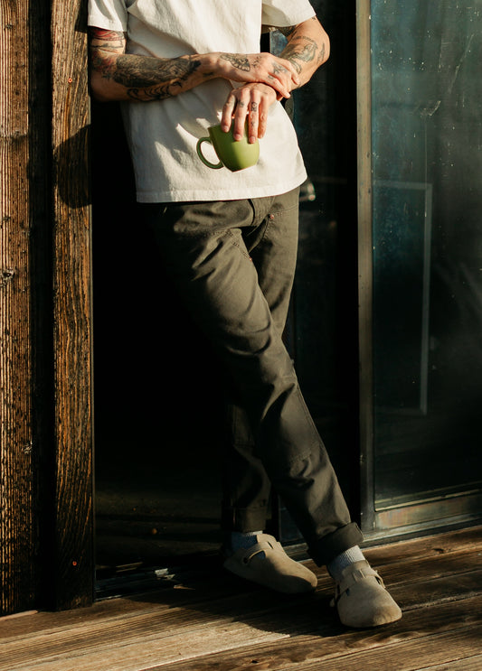 Men’s Draftsman Pant in Vintage Coal, featuring a salt-washed finish on 100% cotton canvas with double-front utility panels and copper rivets.