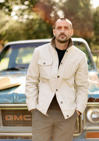 Durable Vintage Coal utility pants with reinforced double-knee panels and triple-needle stitching, paired with a heavy-duty canvas rancher jacket for a classic California workwear look.