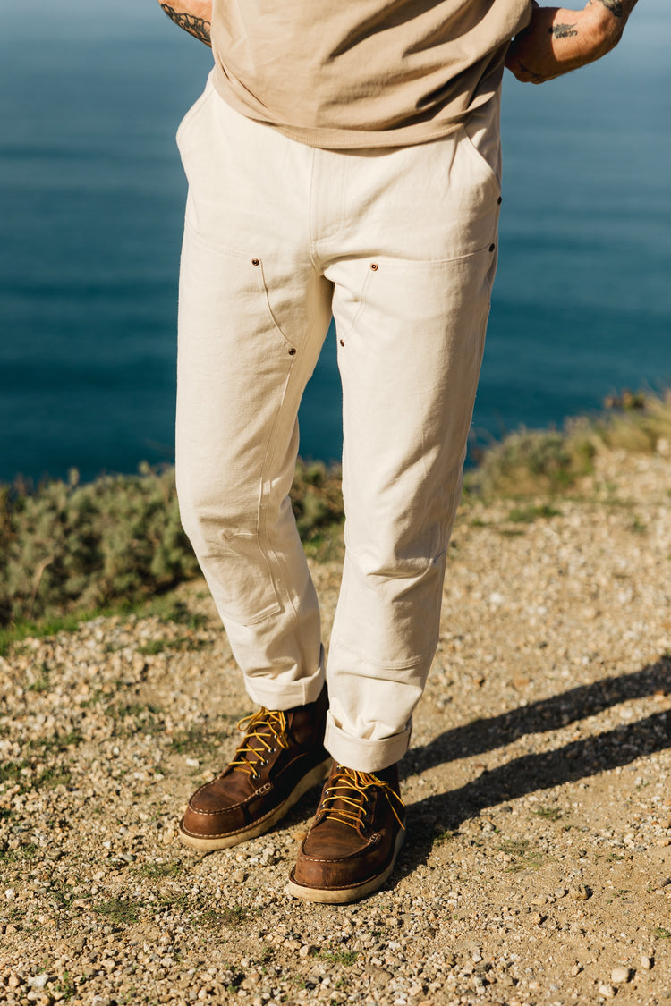 Men’s Draftsman Pant in soft washed cream, featuring a 100% cotton double-front construction with reinforced copper rivets for heavy-duty durability.